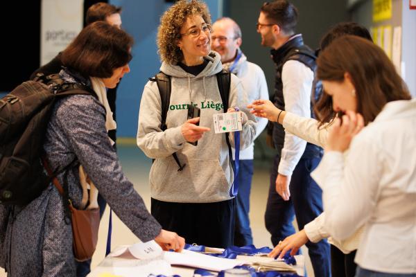 People at the registration desk